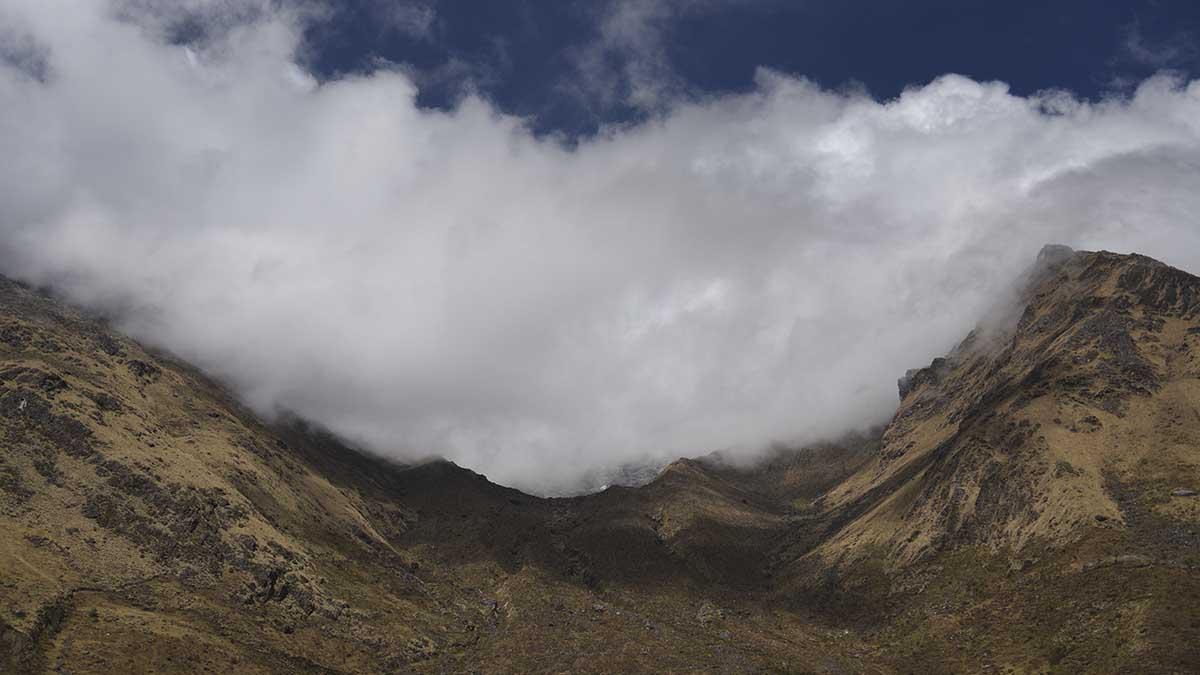 clouds over mountain valley