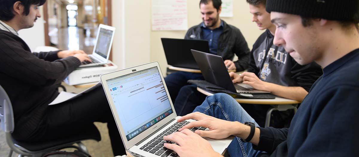 Students studying on laptops